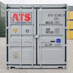 Back view of a 20-ft rental shipping container with standard doors closed