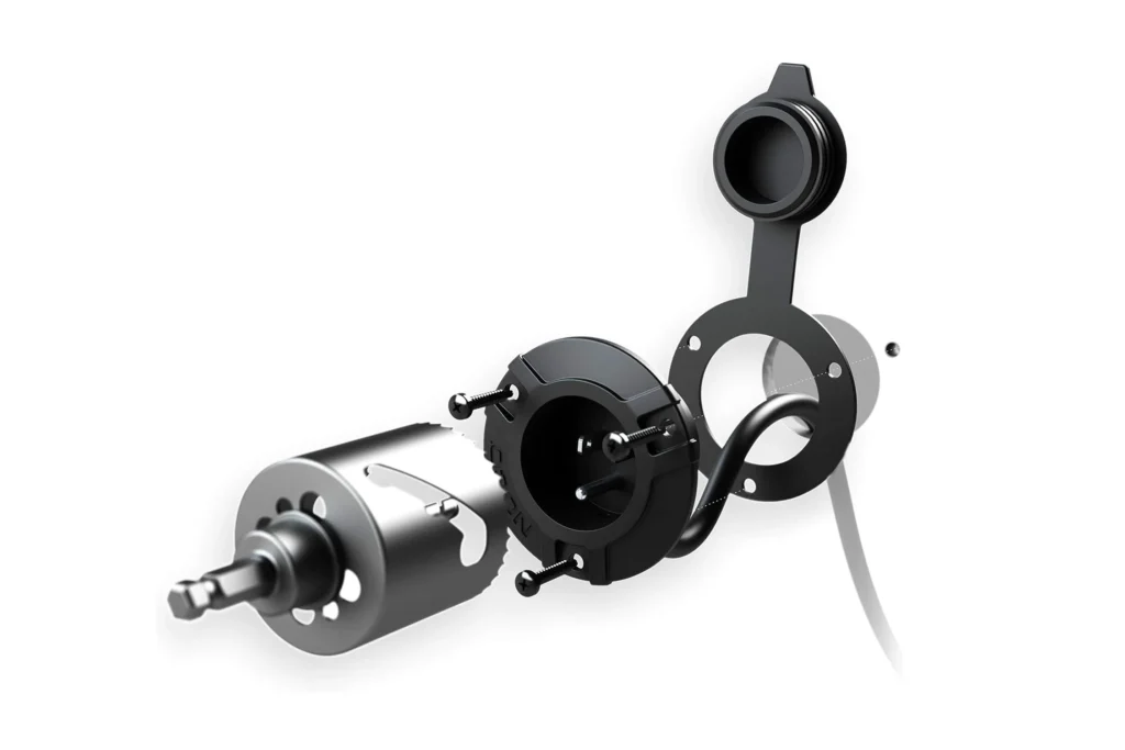 NOCO exterior power inlet power port installation kit for shipping containers, showing hole saw, gasket, backing plate, and mounting screws.