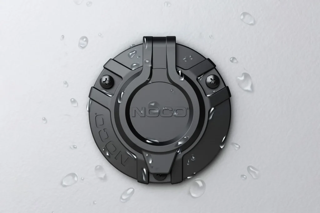 Weather-resistant NOCO exterior AC inlet power port with sealed cover for container exteriors, durable shore-power connection by ATS Containers.