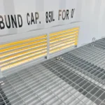 Interior view of a dangerous goods container showing the bunded floor and internal ventilation louvres.