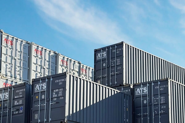 Large Canadian depot with various new and used 20ft and 40ft shipping containers, illustrating 2026 pricing.