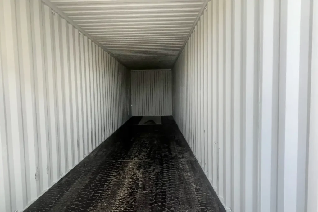 Clean interior of a 40ft high cube shipping container showing bamboo flooring and extra vertical clearance.