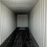 High-quality marine-grade plywood flooring inside a new 40ft sea can for Edmonton industrial use.