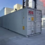 Profile view of a 40ft High Cube shipping container showing the long solid side wall.