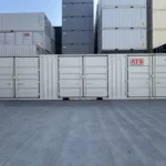 Side view of a 40ft High Cube shipping container with three sets of closed double lateral side doors.