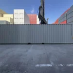 Solid exterior side view of a 40ft High Cube shipping container without lateral doors.