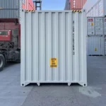 End wall of a 40ft High Cube container featuring the yellow 9'6" high caution decal.