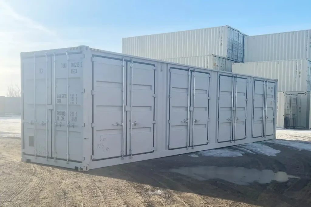 Exterior view of a new 40ft High Cube side-opening container showing four closed side doors and standard end cargo doors on a gravel lot.