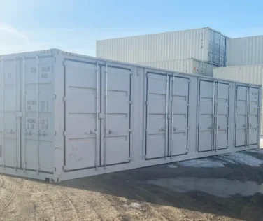 Exterior view of a new 40ft High Cube side-opening container showing four closed side doors and standard end cargo doors on a gravel lot.