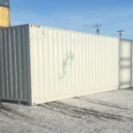 Exterior side profile of a closed 40ft High Cube shipping container featuring corrugated CORTEN steel walls and white paint finish.