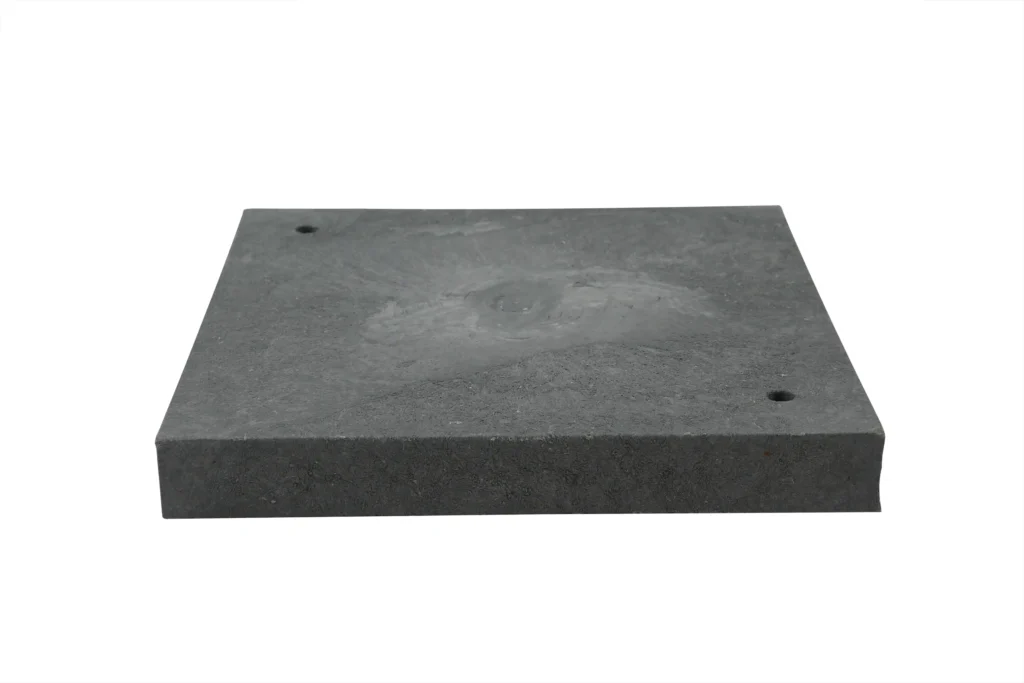 Top-down view of a black heavy-duty shipping container leveling pad featuring integrated alignment holes.