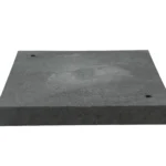 Top-down view of a black heavy-duty shipping container leveling pad featuring integrated alignment holes.