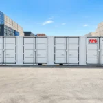 Side view of a light grey 40 ft high cube side door shipping container with four OEM side door sections