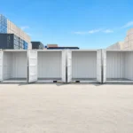 Light grey 40 ft high cube side door container with all side doors open for compartmentalized storage