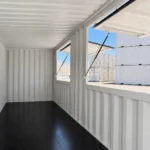 Interior of 20 FT shipping container kiosk with two open serving windows