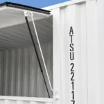 Close-up of flip-up serving window with gas spring strut on event container open