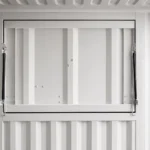 Interior view of flip-up serving window with gas spring struts lock and close