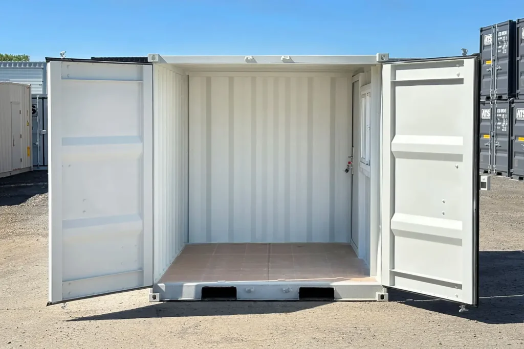 Interior of ATS 9 ft office container with open cargo doors and finished flooring