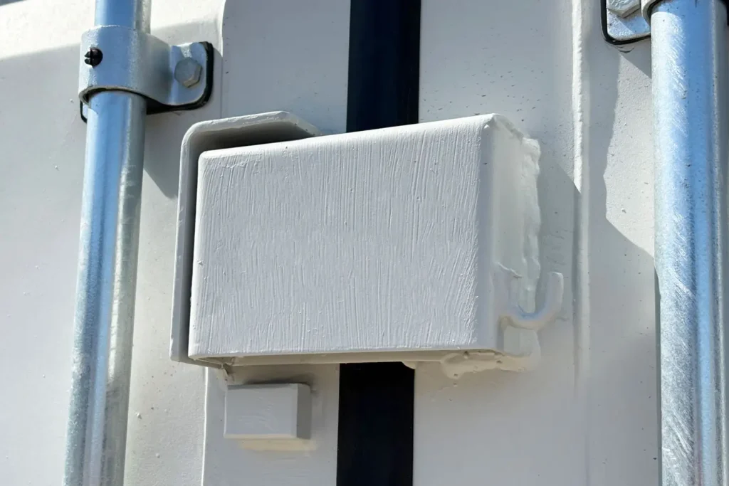 Steel security lock box on the cargo doors of ATS office container
